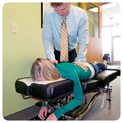 Chiropractor Coon Rapids MN Dillon Sletten Adjusting Patient
